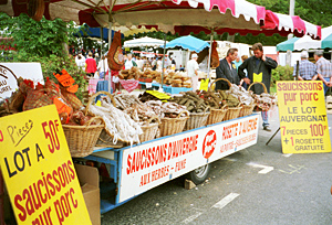 I try to distract Claude from her idée fixe of buying a donkey by talking about all the food we'll see at the fair.