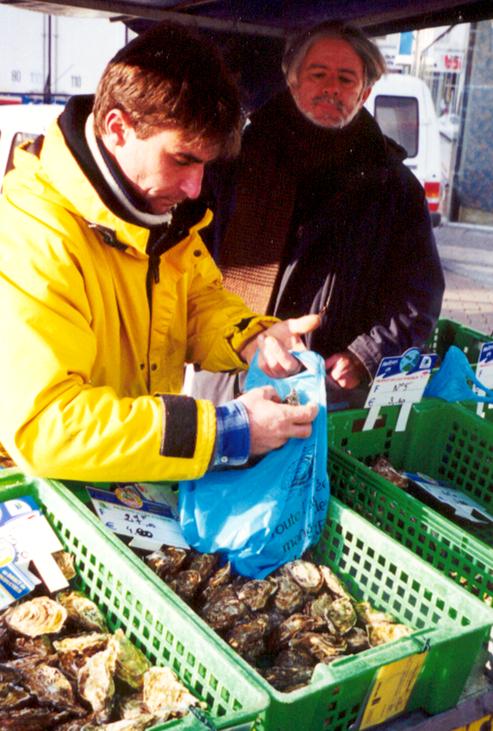 Thierry Sorlut, 35, (left) is teaching me to be an oysterman. His great-grandfather started the family business.