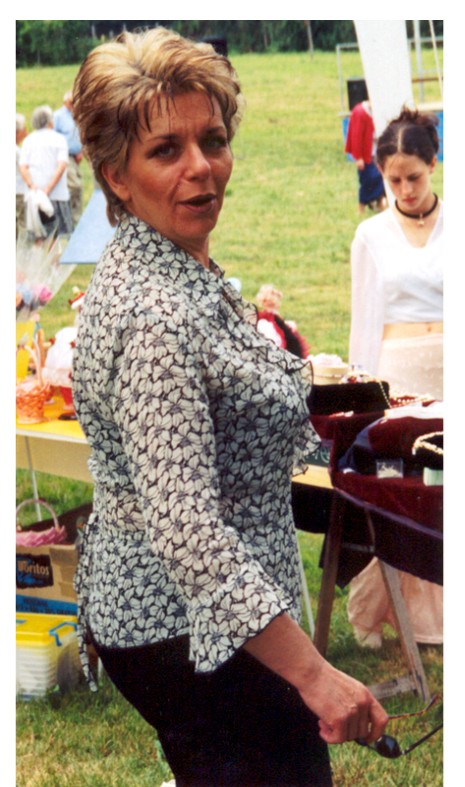 A woman at an outdoor village gathering