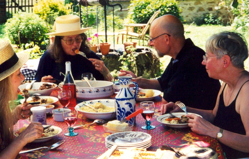 The French in all their glory--table heaped with food, fork in transit. At our home July 22, 2001 (Left to Right) Annie, Claude, Jean-Marie, Dorine....