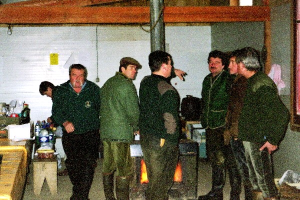 The hunters gather. The former bistro owner(left)takes care of the first order of business--eating.