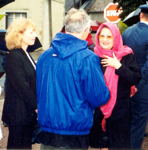People talking at an outdoor gathering