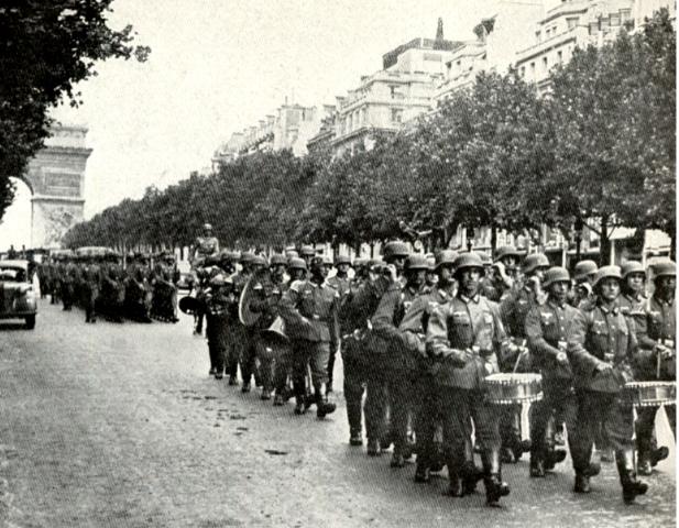 German soldiers making their victory march down the Champs-Elysées in June 1940.