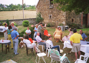 Guests begin to arrive for the neighborhood party. At any gathering of the French, one subject is inevitably the main topic of conversation.