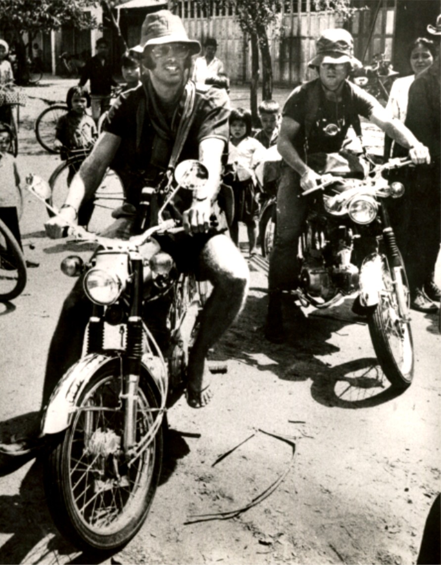 Men on motorcycles, black and white photograph