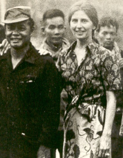A group of people standing outdoors, black and white photograph