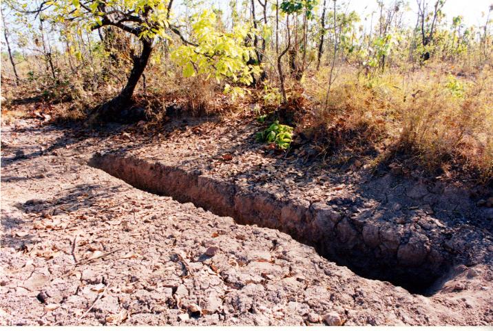 A long trench dug in dry ground
