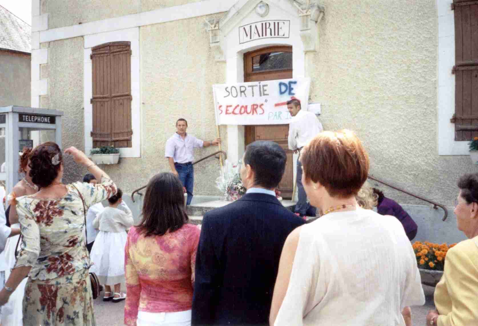 Wedding guests gathered outside a town hall