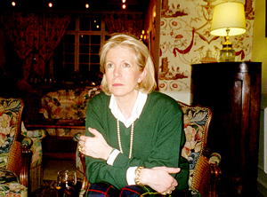 Dominique during a quiet moment at a dinner party .