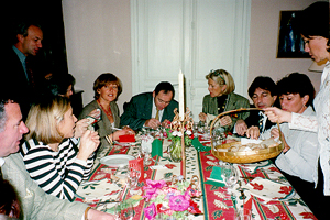 The Lucullus Club beginning a feast. Each of five couples prepares a dish, and they grade each other on how well they do.