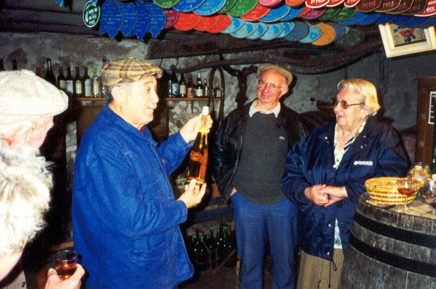Men tasting wine in a cellar