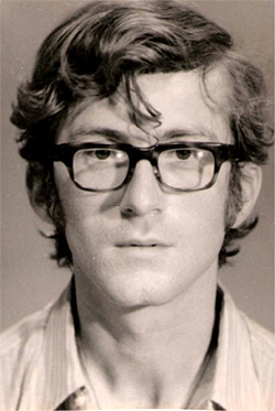 A young man with glasses, black and white portrait